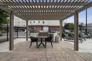 Patio with table and chairs under a pergola